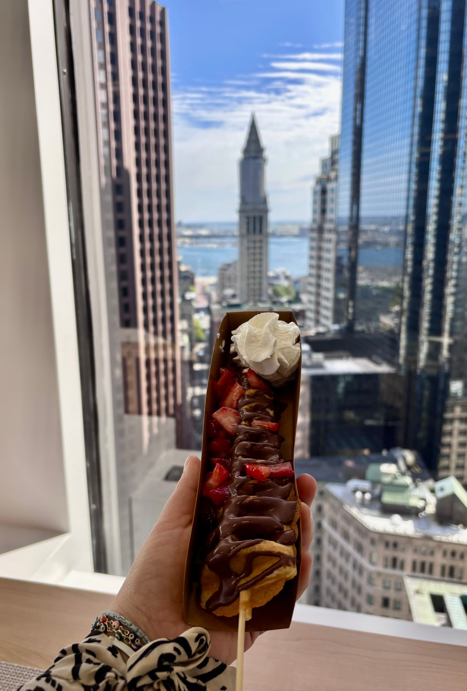 Wander Waffles CO serving made-to-order waffles on a stick with fresh toppings for Greater Boston events.