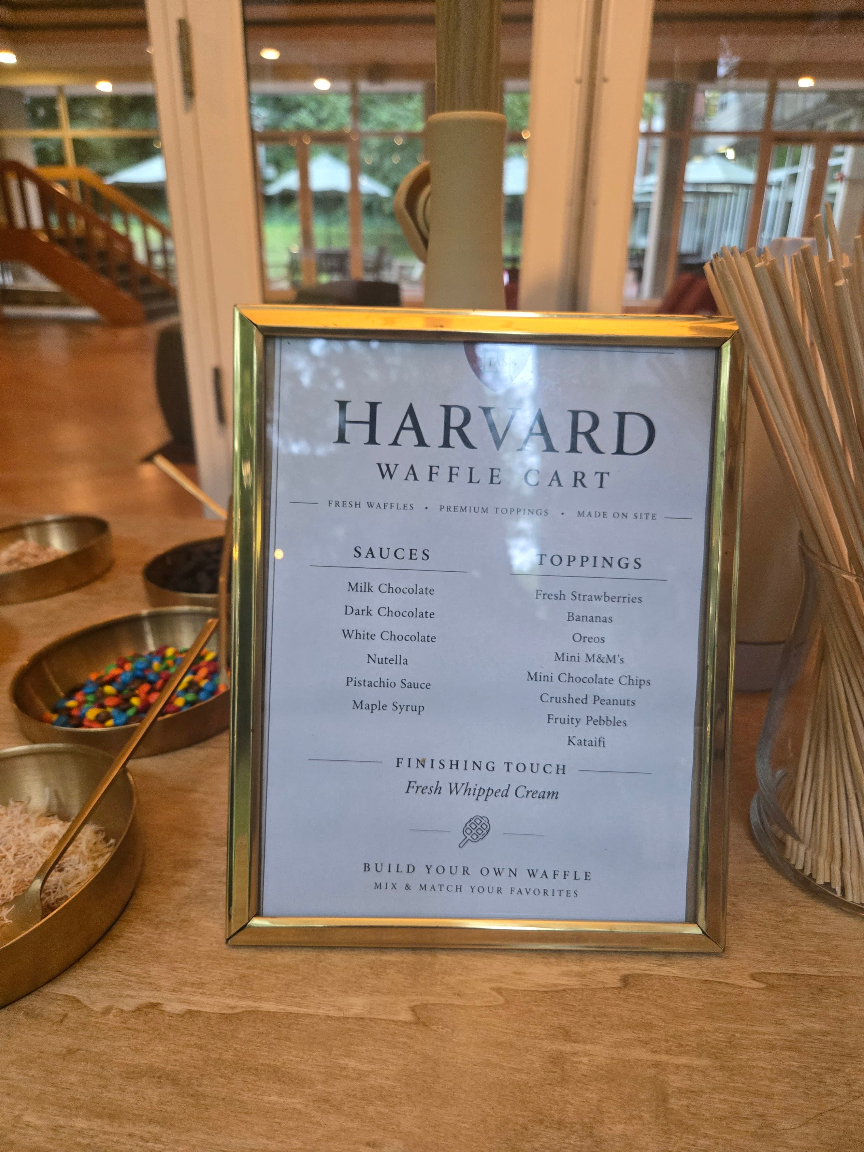 Wander Waffles CO build-your-own waffle cart menu with fresh toppings at a Harvard University dorm event.